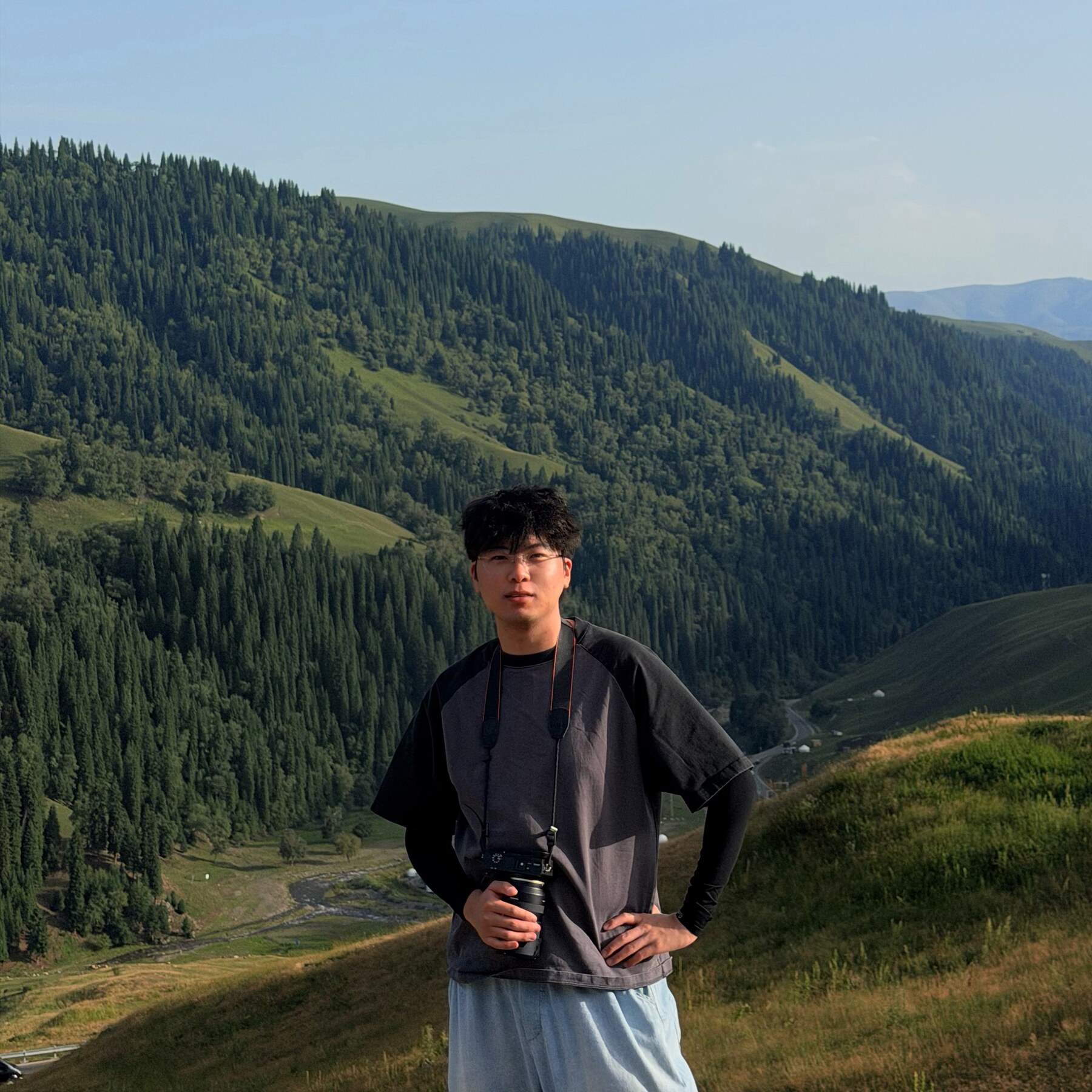 Guangyu Xiang in a mountain landscape